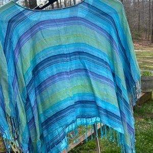 Woman’s multi colored poncho cropped top